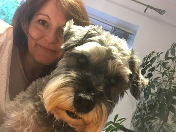 Woman and Mini Schnauzer dog